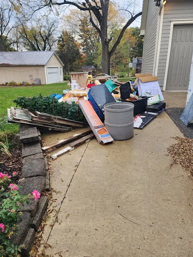 Dumpster being loaded with debris for Residential Dumpster Rental in Toronto